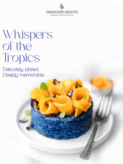 These are the whispers of the tropics. A beautifully plated dessert of blue pea flower rice topped with mango ribbons, this dish is as delicate as it is memorable.