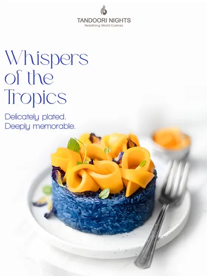 These are the whispers of the tropics. A beautifully plated dessert of blue pea flower rice topped with mango ribbons, this dish is as delicate as it is memorable.
