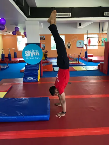 A perfect handstand. This image showcases the strength, balance, and body control that our older students develop through dedicated practice in our grade school program.