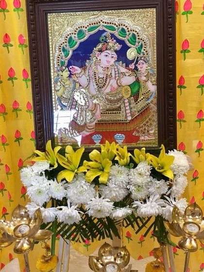 A closer look at the beautiful Pichwai painting used for a religious event. The intricate details and vibrant colours add a layer of artistry and devotion to the decor.