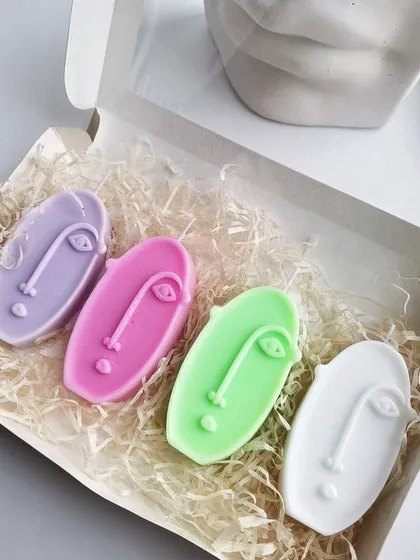 These mini abstract face scented candles are great for adding a modern, artistic element to your decor. They come in a variety of pastel colors.