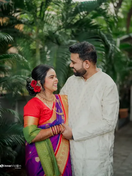 A candid moment of laughter and love. The couple shares a joke, their genuine smiles making this a heartwarming and authentic engagement photo.