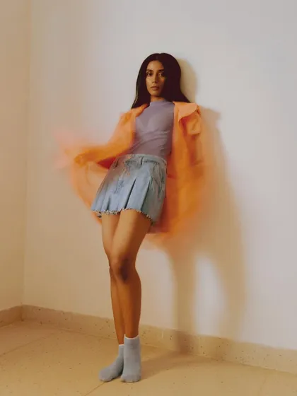 An experimental shot from the archives using a slow shutter speed. I layered a sheer neon orange jacket over a denim skirt and pastel top to create a dreamy, colorful look with a sense of motion.