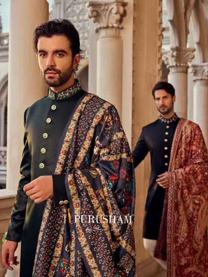 My Amore collection is inspired by the grandeur of heritage. This look pairs a classic, dark bandhgala with a richly detailed shawl, creating a silhouette that speaks of timeless elegance and royal charm. It is for the man who carries his legacy with pride.