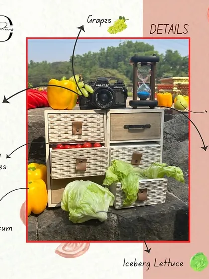 A design board showcasing a quirky decor setup for the 'La Tomatina' theme, featuring a vintage camera, an hourglass, and fresh vegetables like lettuce and capsicum arranged in woven drawers.