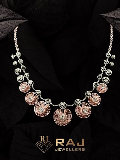 This two-tone necklace combines rose gold and white rhodium finishes in a design of interconnected circles. The intricate patterns and brilliant CZ stones create a piece that is both modern and timeless.
