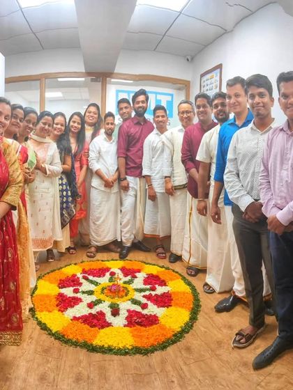 An Onam celebration at a corporate office, complete with a beautiful pookalam (floral carpet). I offer Onam Sadhya catering for offices, bringing the festive spirit to your workplace.