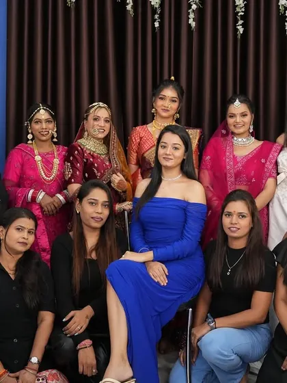 A full class photo with all the students and their models in their final looks, showcasing the talent and camaraderie of the batch.