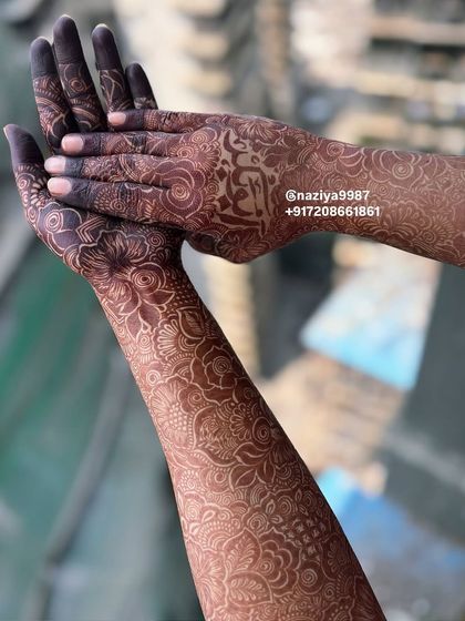 The beautiful stain of the nikah bride's henna, shot against the sky.