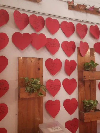 The combination of our signature plant wall and the hanging hearts creates a beautiful, organic feel.