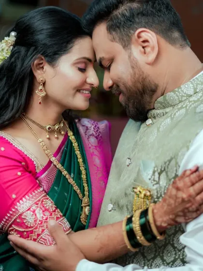 An intimate portrait of a Maharashtrian couple, lost in their own world. This photo highlights our ability to capture quiet, tender moments amidst the wedding celebrations, focusing on the couple's connection.