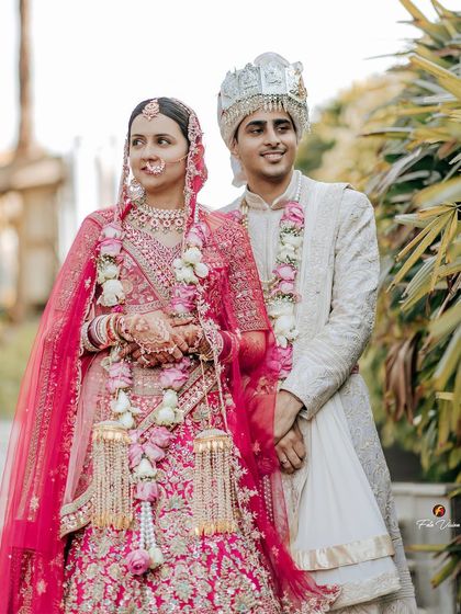 A classic portrait of the newlyweds, their smiles and pose reflecting the happiness of their special day.