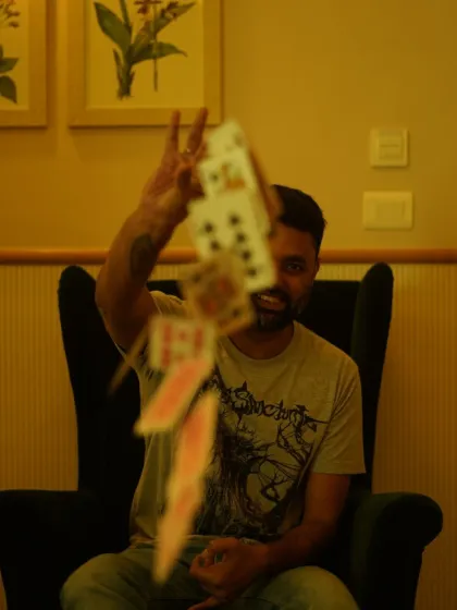 A dynamic shot of me performing card magic. This image captures the illusion and artistry that I bring to every performance.