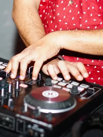 A detailed shot of my hands on the mixer. For me, music is the moonlight in the gloomy night of life, and I pour that belief into my craft.