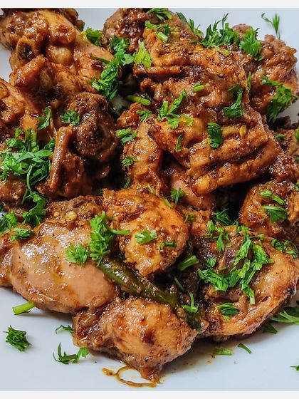 A close-up of the Karnivore Chicken Fry, showing the rich glaze of the homemade masala.