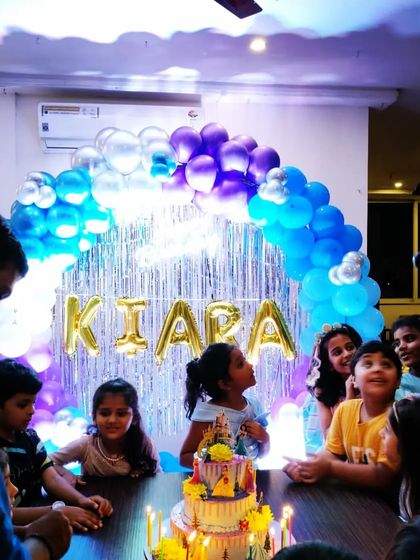 The cake cutting is the highlight of any birthday. Here, at Kiara's party, all the kids gather around, excited for the celebration. Even Mickey Mouse made a special appearance!