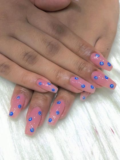 A still shot of the popular evil eye nail art.