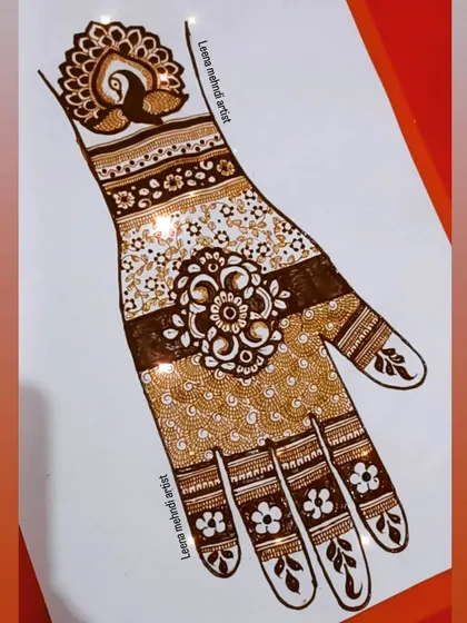 A practice design featuring a central floral mandala and a peacock cuff. The fingers have simple, elegant floral tips.