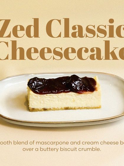 My Zed Classic Cheesecake is baked to perfection. It has a smooth, creamy blend of mascarpone and cream cheese over a buttery biscuit crumble, topped here with a blueberry compote.