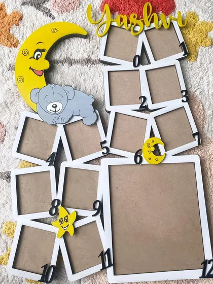 Here is another "First Year" frame design before the photos are added. This one has a sweet moon and teddy bear theme, with numbered slots for each month's photo, creating a beautiful collage of memories.