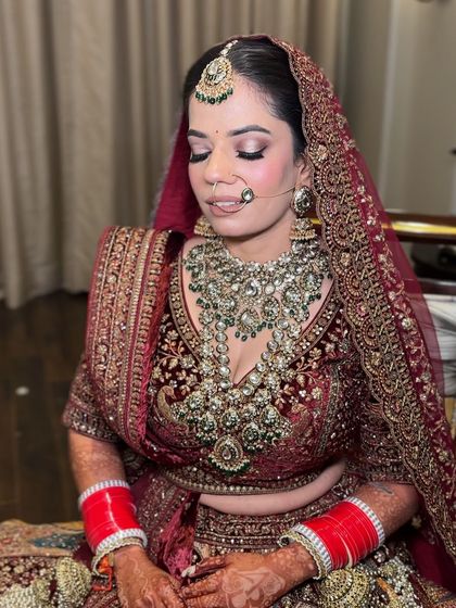 A close-up of the bride's makeup with her eyes closed, showing the seamless blending on the eyelids.