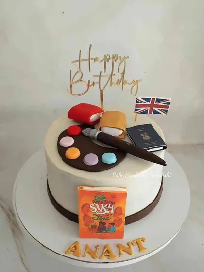 This cake tells the story of Anant, a book cover designer who loves to travel and paint. I included an edible book, a passport, a painter's palette, and the UK flag to represent his passions, showing how we can turn any story into a cake.