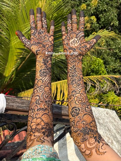 The back of a full bridal set, featuring a mix of bold roses and delicate, lace-like patterns.