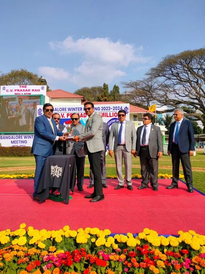 Presenting the Dr. T. Thimmaiah Memorial Trophy.