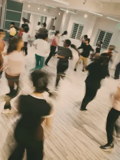 The entire class moving as one during the Trinity Series. The blur of motion captures the high-energy atmosphere of the workshop.