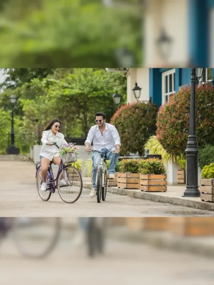 A fun-filled bicycle ride for two. This action shot captures the couple's joyful energy and creates a dynamic and memorable pre-wedding photo.
