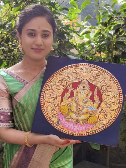 A proud student with her stunning circular Ganesha painting, created through our online course. Her dedication truly shines through.
