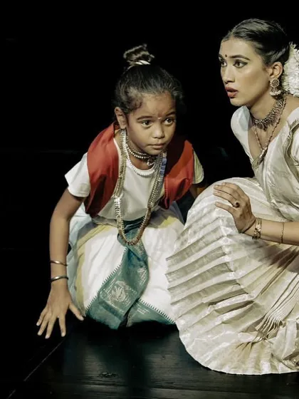 A scene from the production "Panna Dhai," where I am interacting with a child actor. My expression shows concern and guidance, demonstrating my ability to create a believable connection with other performers.