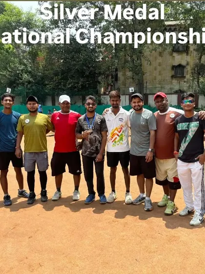 Ritik, our National Championship silver medalist, celebrating his victory with fellow players and coaches. The support of the team is crucial for success at this level.