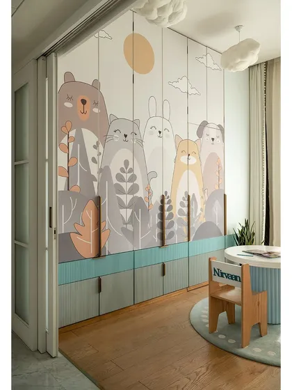 The wardrobe in this kids' room is a piece of art in itself, with adorable hand-painted animal illustrations. The design cleverly conceals the bathroom entry, making the space feel seamless and magical.