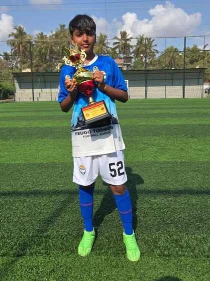 A player from our U14 Feugo Lions team with his trophy.