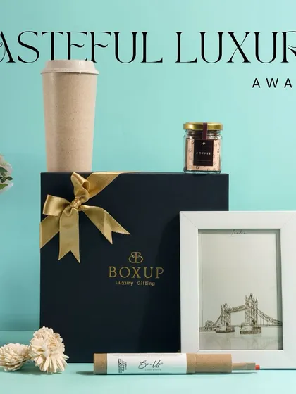 Tasteful luxury awaits. This hamper combines simple, elegant items like a photo frame, a sipper, and a gourmet snack for a gift of good taste.