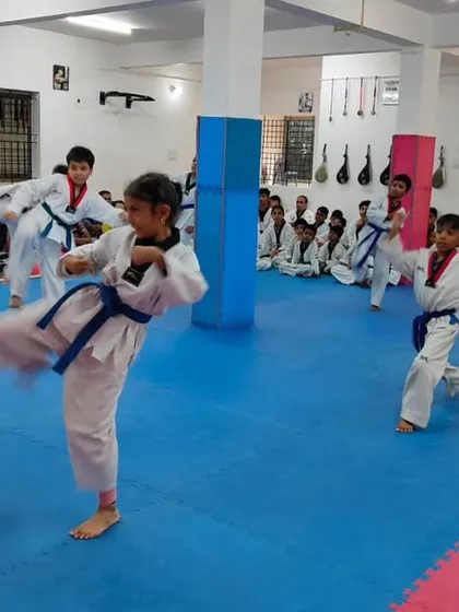 A student executes a high kick.