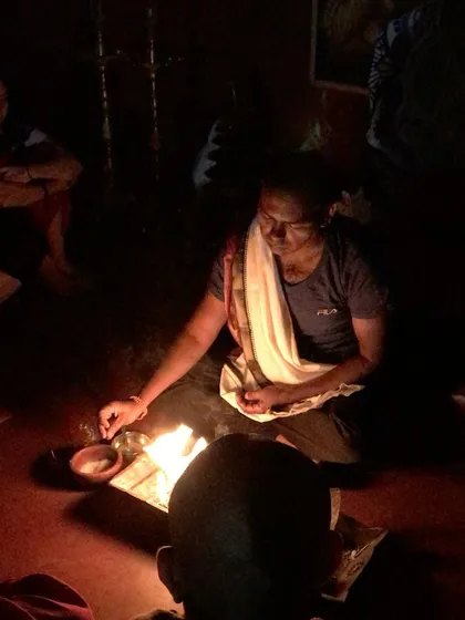 A student performs a personal fire ritual in the quiet of the evening. We encourage these individual moments of devotion and reflection as part of the ashram experience.
