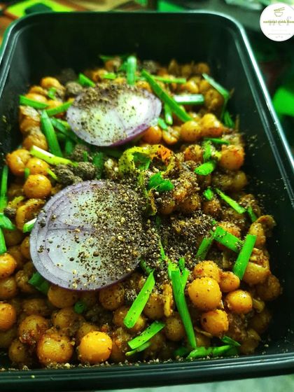 A box of our indigenous Kelichana, topped with ground perilla seeds, which adds a nutty, earthy flavor.