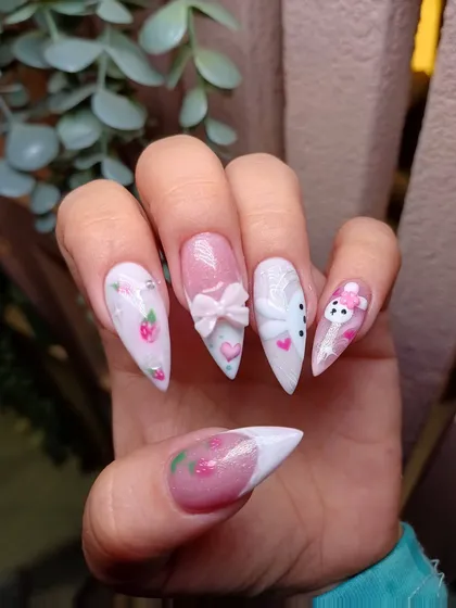 This view shows the full story of our bunny-themed nails, with different art on each finger for a playful and unique manicure.
