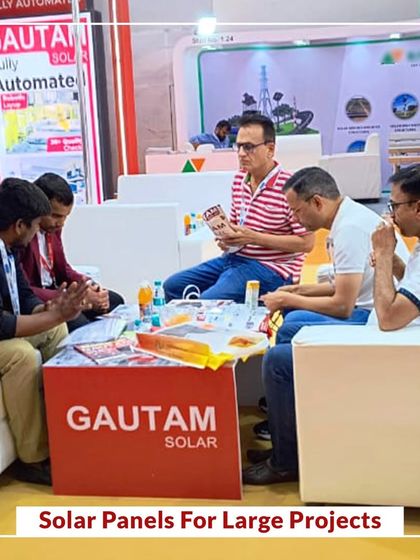 Our team in discussion with visitors at RenewX Hyderabad, focusing on solar panels for large projects.