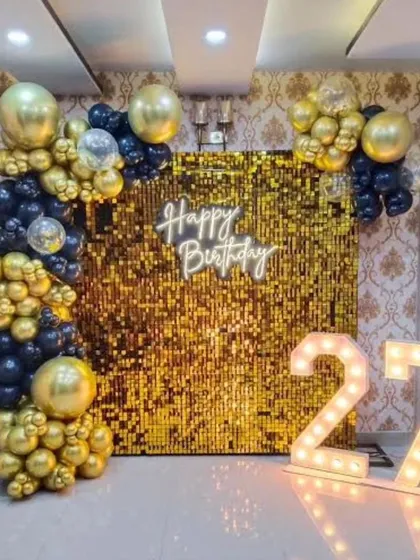 Our sequin backdrops add a touch of glamour to any event. This birthday setup combines a shimmering wall with marquee numbers and a balloon garland for a picture-perfect celebration.