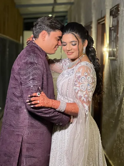A romantic embrace, capturing the joy of the couple during their sangeet.