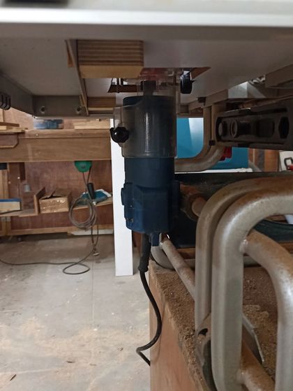I've upgraded my table saw by integrating a router underneath. This allows me to use the saw's fence and dust collection system for routing, which is a huge improvement.