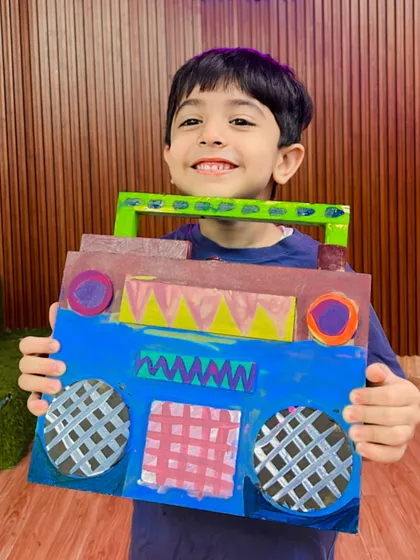 Every child takes home their creations, and we love seeing the pride on their faces. This fantastic pop-art boombox is just one example of the cool, functional art we make.