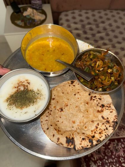 A classic North Indian thali with dal, bhindi (okra), roti, and curd. This shows how traditional home-cooked meals are the foundation of my diet plans.