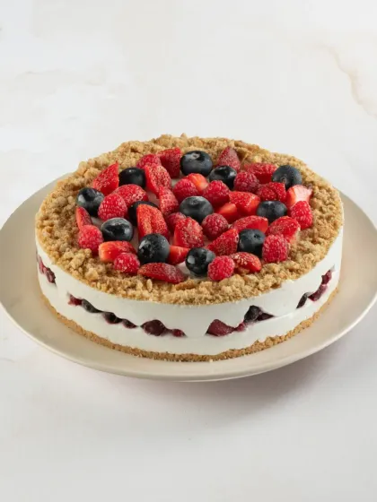Our Fresh Mixed Berry Cheesecake has a crunchy biscuit base, a creamy cheesecake filling, and a generous topping of fresh strawberries, blueberries, and raspberries.