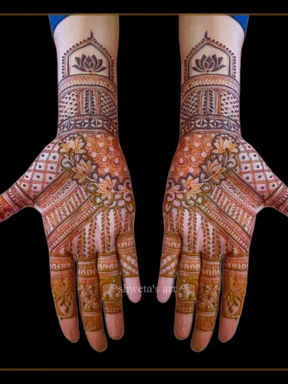 A classic Indian mehendi design that's perfect for wedding guests. The pattern is detailed but doesn't provide full coverage, making it elegant and comfortable to wear.