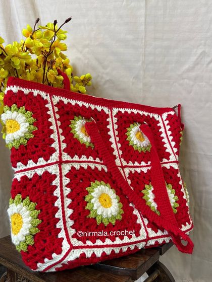 Another angle of the daisy tote, highlighting the texture and craftsmanship of the crochet work.