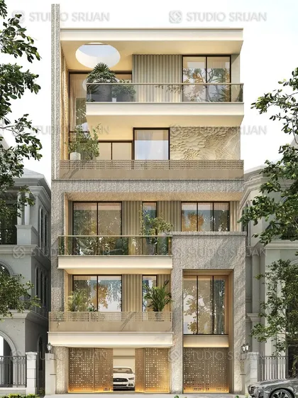 The front elevation of the Prashant Vihar residence. This view highlights the rich texture of the stone cladding and the intricate metalwork on the gates, combining robust materials with fine detailing.